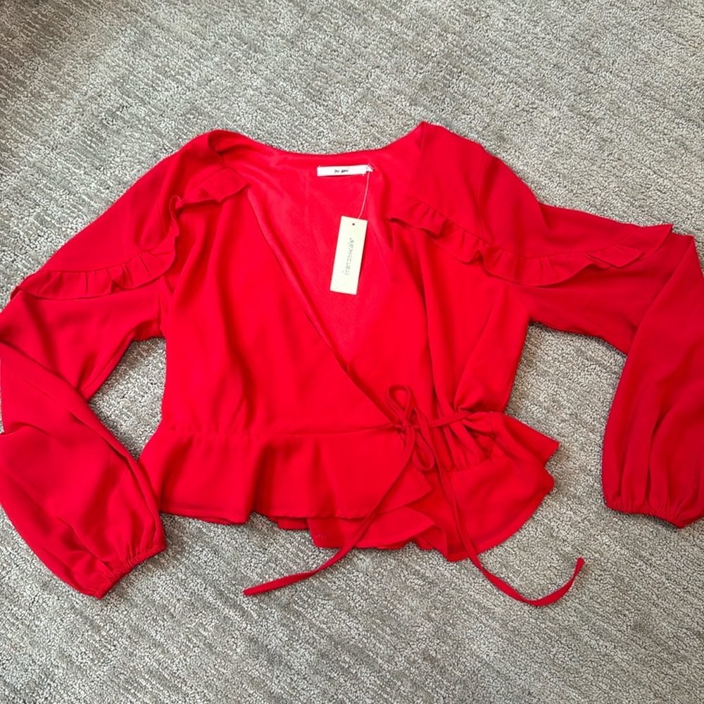 Francesca’s Miami Red wrap blouse, size medium. Never worn